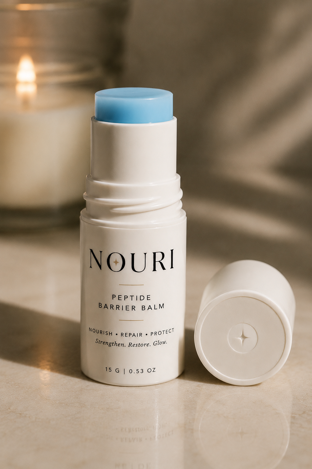 Nouri Peptide Barrier Balm in white twist-up stick packaging with light blue balm visible, cap off to the side
